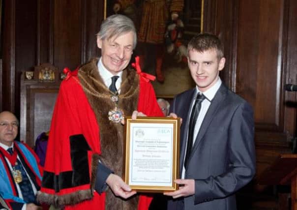 Sheriff of the City of London, Nigel Pullman presents Limavady student William with his award
