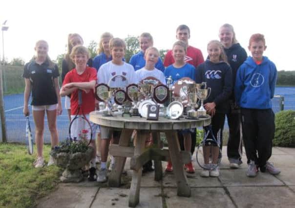 Some of the A-Team Tennis Club junior members who achieved success in the past year.