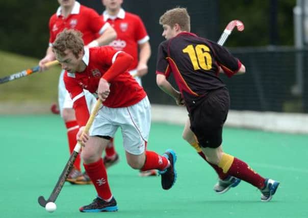 BREAK... Cookstown's Euan Butler breaks down the line during last Saturday's clash with Mosley.INMM1013-343SR