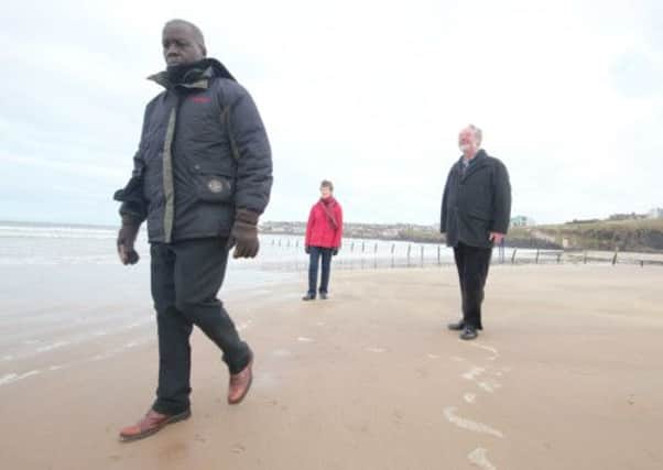 Taking a stroll on Portstewart Strand Beach over the weekend is Bishop Hilary Adeba from Yea in South Sudan. Bishop Hilary was a guest of Agherton parish Church in Portstewart were he addresed parishoners. He is accompanied on his walk with church members Beryl and Frank Dobbs.PICTURE MARK JAMIESON.