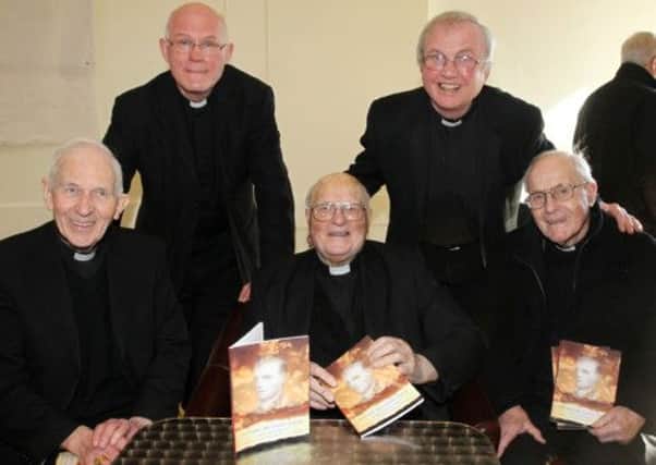 Archdeacon Kevin Donnelly (front centre) who last week launched his book "Letting My Light Shine" at All Saints Parish Centre is seen here with Retired Bishop of Down & Connor Rev Patrick Walsh (front left), Dean of Down & Connor Fr Brendan McGee (front right), All Saints PP Fr Paddy Delargy (back left) and Bishop of Down & Connor Rev Donal McKeown. INBT 10-100JC