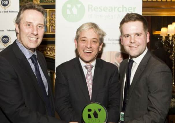Peter Harrison receives his 'Researcher of the Year' Award from the Speaker of the House, John  Bercow, in the presence of Ian Paisley jnr.