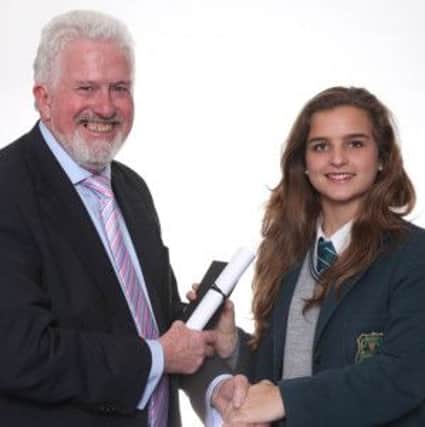 Mercedes Monton, a former pupil of Thornhill College, flew all the way from Spain to pick up her GCSE Top Candidate award in Spanish.  She is pictured with CCEA Chairman Trevor Carson at the CCEA Celebrating Excellence ceremony in Lisburn.