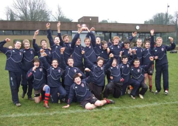 The Ballymena Academy Under-14 XV celebrate their success at the Inst tournament.