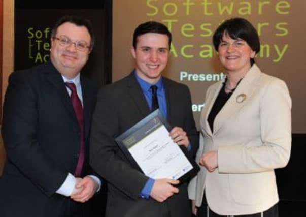 Tony Keers, from Newtownabbey, pictured at an awards ceremony for graduates from the Software Testers' Academy with Employment and Learning Minister Dr Stephen Farry and Enterprise, Trade and Investment Minister Arlene Foster. INNT 11-452-con