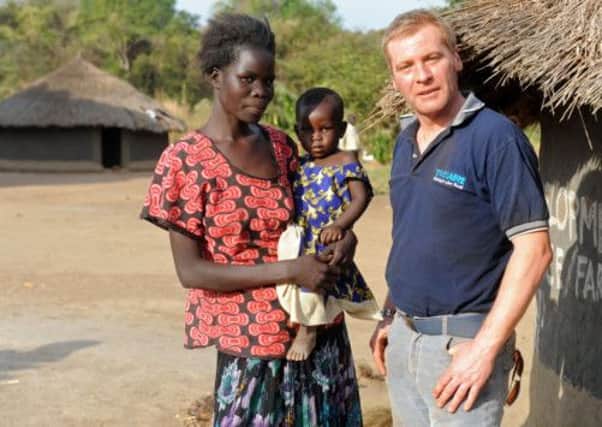 David O'Hare from Newtownabbey, who works for Trocaire, pictured in Uganda. David has taken the opportunity at St Patrick's Day to thank the people of Co. Antrim for their fantastic support at Lent and throughout the year. Photo: Justin Kernoghan