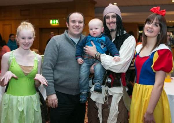 John and Kurtis Dale from Glengormley pictured with Jack Sparrow (Ryan Moffett), Tinkerbell (Erin Gillies) and Snow White (Jenna Macartney) at the TinyLife Disney tribute breakfast at the Clarion Hotel.  INCT 11-448-RM