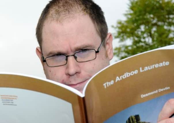 Ardboe native Desmond Devlin with his new book of poems.INMM4012-419SR
