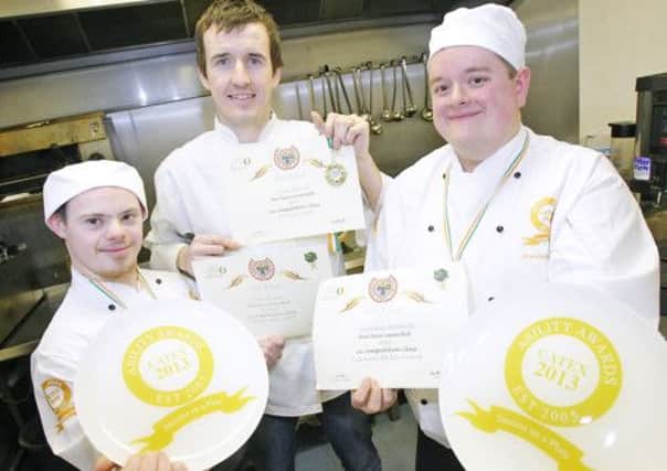 Two trainees with West Belfast Charity NOW celebrate after winning medals at the 2013 Catex Exhibition last week (February 19)  Irelands largest annual Foodservice event. Brendan Donnelly (left) took Gold in the Ability Award category of the competition while and Iain Wilson (right) took Bronze.  The two trainees are pictured with award-winning Chef Liam McEvoy from The Stables restaurant in Lurgan who mentored Brendan and Iain in the run up to last weeks event.