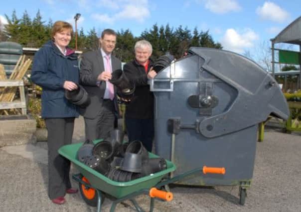 Launching the pot recycling scheme are LBC Environmental Services Officer Elaine Smith; Director of Environmental Services Philip Thompson and John Shannon from Inver Garden Centre. INLT 11-368-PR
