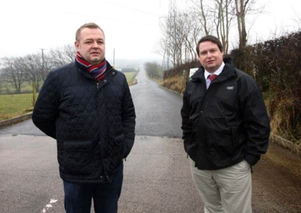 Mallusk resident Robert Foster and Councillor Mark Cosgrove at the proposed entrance of the new incinerator site in Mallusk. INNT 11-023-FP