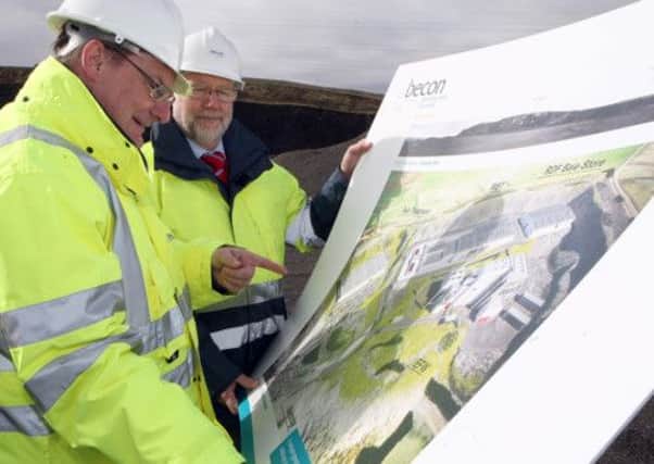 Ricky Burnett policy and operations director of Arc 21 and Ian Smith project manager with the Becon consortium, examine plans for the Mallusk incinerator proposals in the Hightown Quarry. INNT 11-037-FP