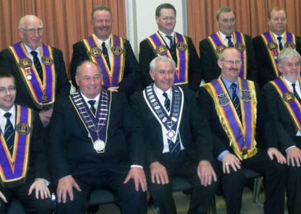 At the Installation of County Antrim Grand Royal Arch Purple Chapter office bearers in Carnlea Orange Hall, Ballymena on Saturday 2nd March are L to R: (front row) Wor Bro Rev David McCarthy (Deputy County Grand Master), Rt Wor Bro Kenneth Hull (County Grand Master), Most Wor Bro Norman Bell (Grand Master of the Grand Royal Arch Purple Chapter of Ireland), Rt Wor Bro John Parker (Outgoing County Grand Master) and Wor Bro William Logan (County Grand Registrar).  (back row) Wor Bro Bertie Brown (Deputy County Grand Treasurer), Wor Bro Francis Beckett (County Grand Director of Ceremonies), Wor Bro Alex McClintock (County Grand Lecturer), Wor Bro John Milliken (County Grand Inner Guard) and Wor Bro Bertie Jordan (County Grand Treasurer).