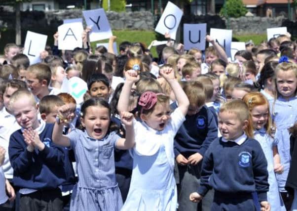 Pictured are pupils from Holy Child Primary school in west Belfast, winners from People's Millions winners 2012.