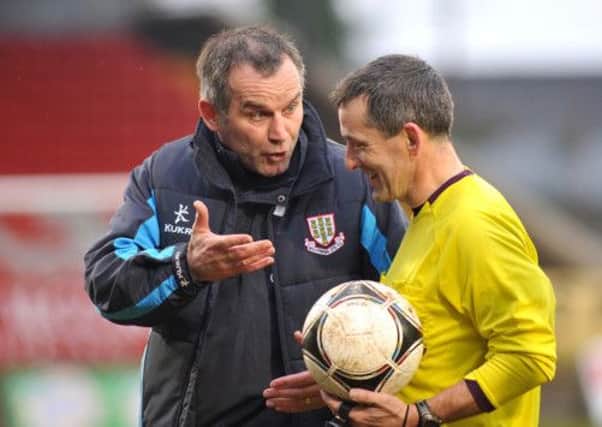 Ballymena United manager Glenn Ferguson has an exchange of views with referee Hugh Carvill following Saturday's match at Shamrock Park. Picture: Press Eye.