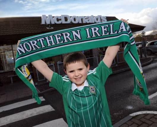 Craigavon youngster, Lee Smylie, proudly displaying his Northern Ireland supporters scarf, is all set to walk out with the Northern Ireland team as a McDonalds Player Escort next week.  INLM12-003