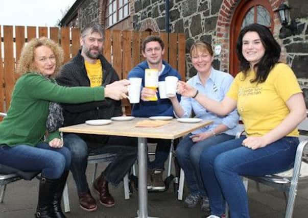 From left to right: Heather Baird, Roger Robinson, Gareth Baird and Lorna Mahon share a celebratory toast with NICFC Corporate Fundraiser Sorcha Chipperfield.