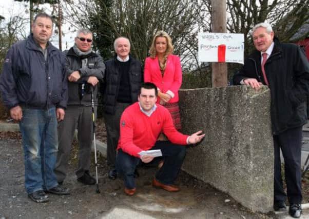 Marc Woods sec Warinstown UUP Branch at the spot where the post box has been removed with from left,Stephen Harrison, Lenny Deans, Eddie Nimmons, Jo-Anne Dobson MLA and Councillor George Savage.INLM12-601.