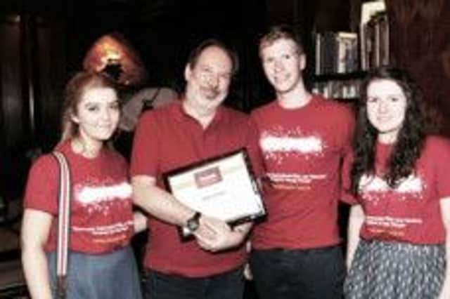 Cinemagic young filmmakers Katie Linton (16) from Moneymore, Martin McKenna (19) from Bellaghy and Lara McIvor (17) from Derry with Oscar winning film music composer Hans Zimmer at his Remote Control Studios in Los Angeles during Cinemagic LA. INMU1213-051X
