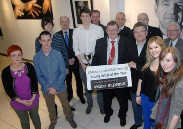 John Ramsey, Ballymena Rotary President; Roy McKeown, event organiser; and fellow Rotary Club members joined by the finalists of the "Young Artist of the Year" photographed at the exhibition of their work in the Braid Arts Centre. INBT 13-825H