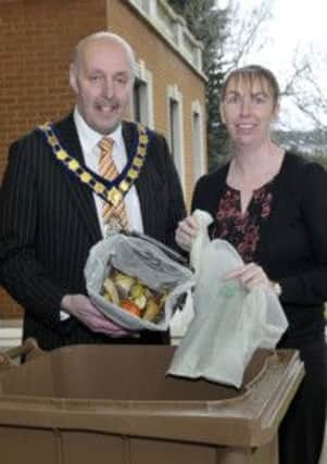 Banbridge District Council Chairman Cllr Junior McCrum and Environmental Educational OfficerTracey Fitzpatrick promote the Compostable Bags which are being delivered throughout the district  to be used by households to deposit waste food into the brown caddy and then into the brown bin  © Edward Byrne Photography INBL13-209EB