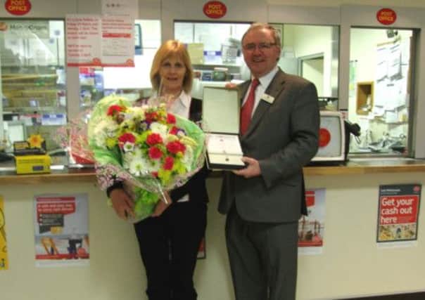 John McConaghie of Monkstown Post Office, who this week received a Long Service Award from the Post Office, pictured with his wife, Emily. INNT 13-538CON