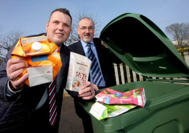 Pictured promoting the message that Tetra Paks can now be recycled in your green bin is (left) Chairman of the Environmental Services Committee, Councillor Andrew Ewing and Director of Environmental Services, Mr Colin McClintock