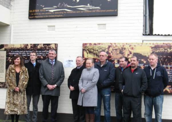 At the Mourneview mural from left to right are: Jennifer Hawthorne, NIHE, Andrew Dunlop, Manager of the Jethro Centre, Ciaran Hanna, SEUPB, Comghal McQuillan, NIHE, Kim Quinn, NIHE, Mark Tipping, Ivan Chapman, John Carson, Johnny Mercer, Mourneview and Grey Estates Community Association.