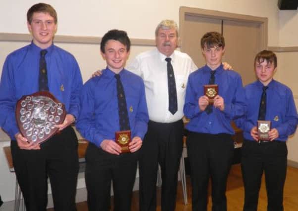 The 16th Newtownabbey BB Masterteam - Mark Hetherington, Kyle McCauley, Jack McMahon and James Loney - receive their trophies from Walter Lambe (centre). INNT 14-501CON