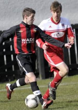 Wakehurst defender Douglas Stevenson tracks his Banbridge Town opponent during the Ballymena side's 1-0 victory on Saturday.