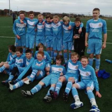 Ballymena United under 13s celebrate their National League title win on Saturday.