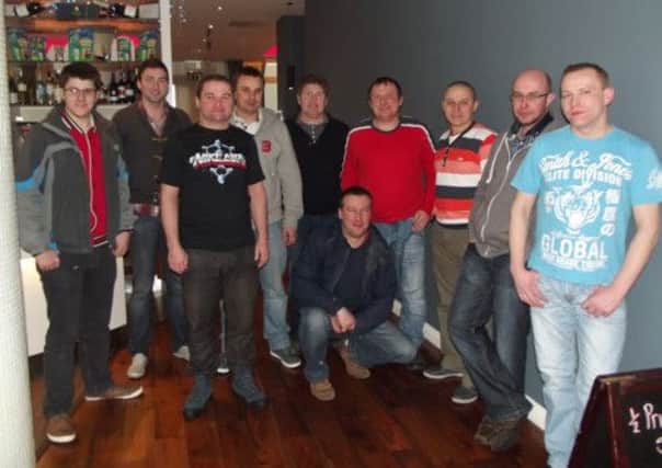 Members of Moneyslane Football Club and also members of the Lithuanian group who have teamed up.