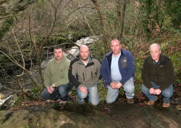 Roe Angling Association, Dean Martin vice chairman, Jonathan Elder committee member, Tommy Simpson chairman, and Terry Butteress committee member, beside the river Roe. INLV0912-511KDR
