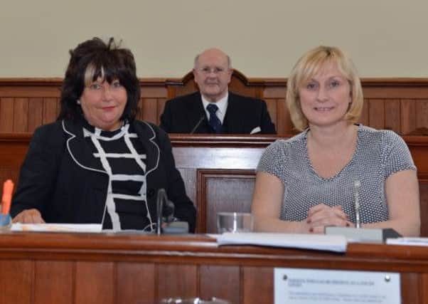 Larne court officials Avril Finlay and Louise Weatherhead are pictured with District Judge Mr Robert Alcorn on the last day of court at Larne courthouse. INLT 14-002-PSB