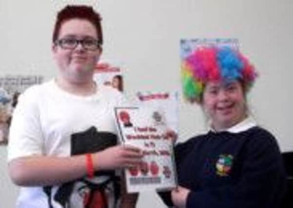Young people at Hill Croft School got into the Red Nose Day spirit on March 15 and raised the fantastic sum of £413 for Comic Relief. INNT 14-511CON