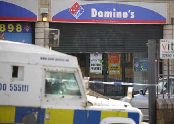 The scene at Dominos Pizza shop on Kennedy Way Belfast where Kieran McManus, age 26, a pizza delivery driver, was shot dead on Saturday evening. Mr McManus was originally from the Turf Lodge area of west Belfast but had moved to Crumlin. Picture: Cliff Donaldson