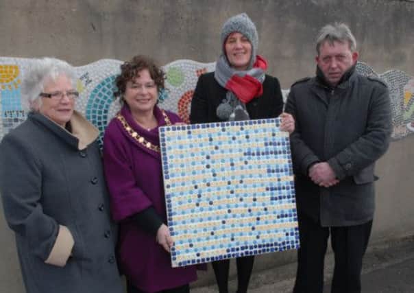 Patricia McConnell of Carnlough Community Association, Larne Mayor Gerardine Mulvenna, artisit Pauline Matthew and Noel Anderson from the Northern Arc Project at the unveiling of the Beachlands mosaic. INLT 14-339-PR