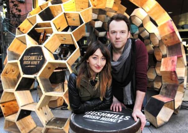 ©Press Eye Ltd Northern Ireland - 4th April 2013
Mandatory Credit - Picture by Darren Kidd /Presseye.com

 To celebrate the launch of Bushmills Irish Honey, the latest addition to the Bushmills collection of premium blends and single malts, Bushmills commissioned some good friends who are artisans to make the launch memorable by handcrafting a 14 square foot Honey Hive. 
2500 screws, 250 hours, 200 hexes and 10 whiskey casks later, the handcrafted wooden hive took its place in Belfast City centre and played host to a surprise live gig from acclaimed Northern Irish artist Rams Pocket Radio, AKA Peter McCauley. He has emerged as one of Ireland and the UK's most exciting artists, has toured with Snow Patrol and enjoyed Radio 1 playlisting.
The celebration continued later that evening with a launch event gig in Oh Yeah Music Centre where Rams Pocket Radio headlined along with other indie music artists, Runaway Go and Verse Chorus Verse.

PRESS RELEASE

BUSHMILLS INTRODUCES BUSHMILLSAE IRISH HONEY

 SMOOTH, NO