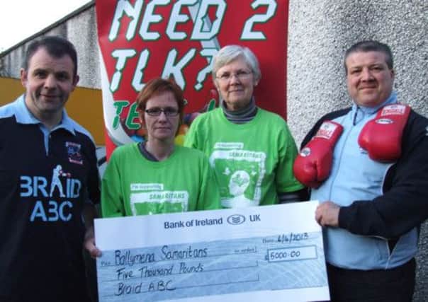 Ballymena Samaritans representatives Allana Jackson and Margaret Black receive a cheque for £5,000 from Eamonn Loughran and Sherman Wright, proceeds of a recent 'white collar' boxing night hosted by Braid Amateur Boxing Club.