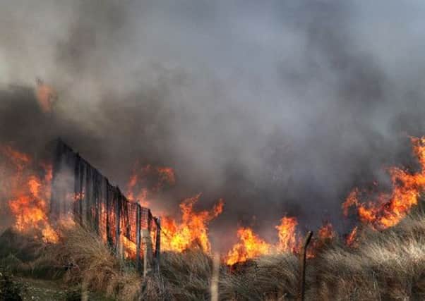 Fire crews tackle a blaze in Portrush Co-Antrim which broke out among sand dunes within the grounds of Portrush golf clubs, the Rathmore Club and Royal Portrush. Picture Margaret McLaughlin © by-line 6-4-13