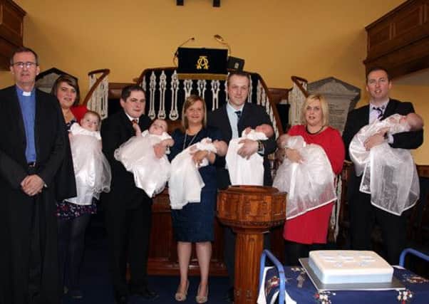 The Rev. A. Wilson minister for Ballykelly Presbyterian Church pictured with the 3 sets of twins whom he has baptised in the last three months. All the babies are boys, 2 sets are identical, two of the mums are cousins and this is a first in the history of Ballykelly.
To mark the occasion, everyone in the congregation at the christinings received  a piece of cake which was specially made. Pictured with Rev Wilson (L-R) are Donna & Nigel Morrow with William and James, Leanne & Mark Scott with Olly and Logan and Paula & Stuart with Noah and Max. INLV1413-421KDR