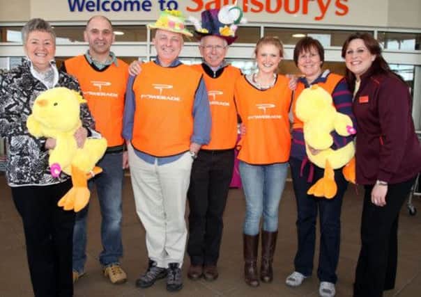 Gillian Ekin (store manager) pictured right with the St. Patrick's Church team and friends at a fundraising event in Sainsbury's on Saturday. The team are raising funds for a mission trip to Kiwoko Hospital Uganda in June. CR14-422PL