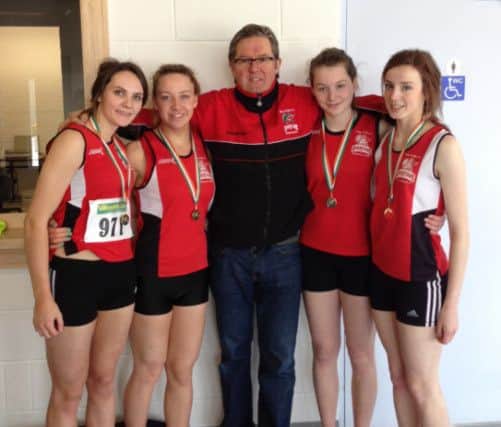 City of Derry Spartans Ladeis 4x200m relay squad which was crowned National Indoor champions and new national U19 record holders at the Athlone Arena on Saturday. Their winning time of 1 minute and 45.18 seconds defeated the 2004 figures of 1 minute and 45.36 seconds set by Cork club, Leevale AC. Pictured left to right are - Megan Devine, Ciara Armstrong, Eamonn Gee, coach, Jenny O Brien and Tamara Boyle.