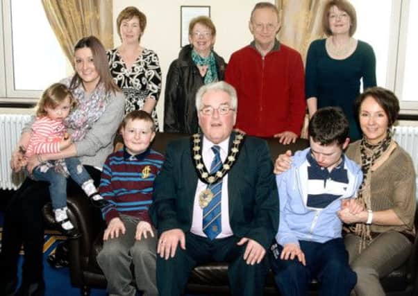 Ballymena Mayor PJ McAvoy with members of the Ballymena Autism group who were invited to the Braid Arts Centre Mayor's parlour as part of the "Lights it up Blue" to celebrate World Autism Awareness Day 2013. INBT 15-801H