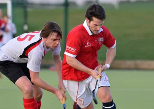 Mandatory Credit: Rowland White/Presseye
Men's Hockey: Premier
Teams: Annadale (white) v Cookstown (red)
Venue: Lough Moss
Date: 12th January 2013
Caption: Stuart Smyth, Cookstown and Chris Morrow, Annadale