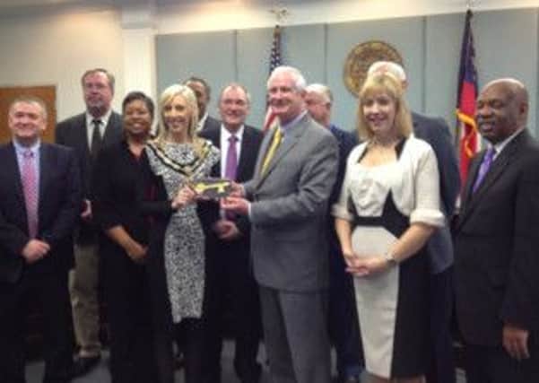 Mayor of LaGrange, Jeff Lukken, presenting the Key to the City of LaGrange to Mayor of Craigavon, Councillor Carla Lockhart, together with the Craigavon delegation and the Council Members of the City of LaGrange.