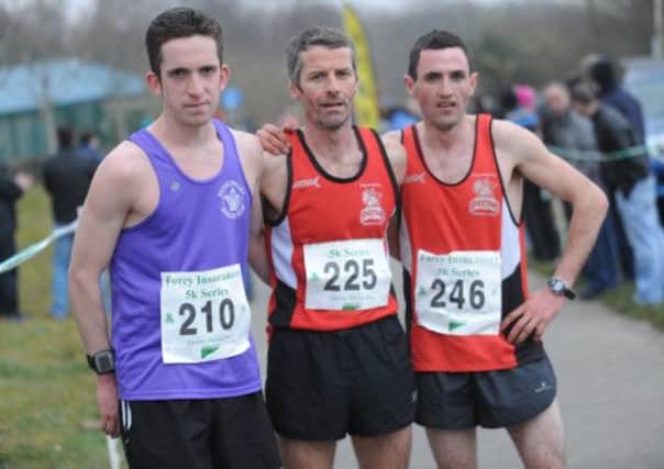 Pictured left to right Scott Rankin, Foyle Valley Athletic, runner up, Declan Reed, City of Derry, winner and Richard Johnston, third lead at the Furey's 5K at Bay Road.