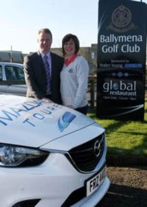 Neil Dixon of Walter Young Mazda, Broughshane, who sponsored the recent Saturday competition at Ballymena Golf Club, pictured with club official Elaine Mark. INBT09-235AC
