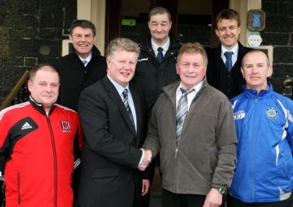 Wakehurst chairman Billy Erwin and his Northend United Youth counterpart Johnny Sayers shake hands on the new partnership between the two clubs. Included are: Glen Spiers (Wakehurst U-17 manager), Ian Gregg (Wakehurst Manager), Arthur McClean (Wakehurst Committee), Dougie Stevenson (Wakehurst captain) and John Devlin (Northend United Youth). INBT16-226AC