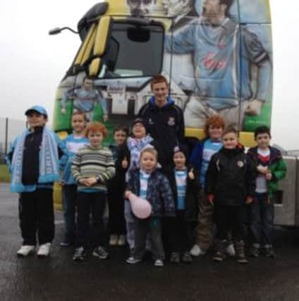 Members of Junior Sky Blues pictured with United vice-captain Aaron Stewart and the McBurney Transport lorry at the club's last meeting.